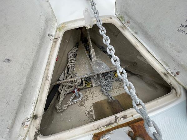 Anchor locker of 1984 Catalina 30 sailboat with chain and rope storage.