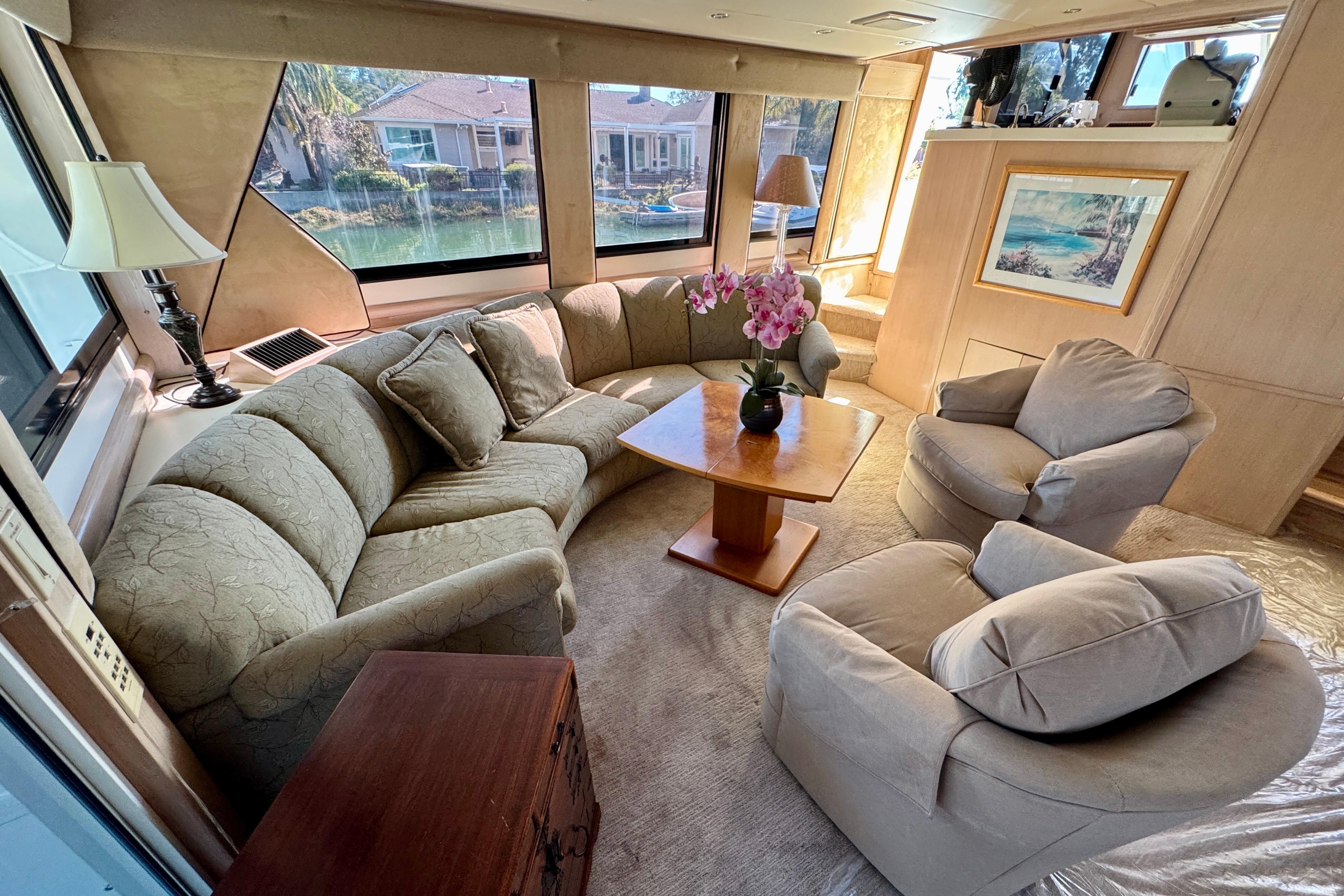 Luxurious interior of 1993 Tollycraft 57 Pilothouse Motor Yacht with elegant seating and decor.