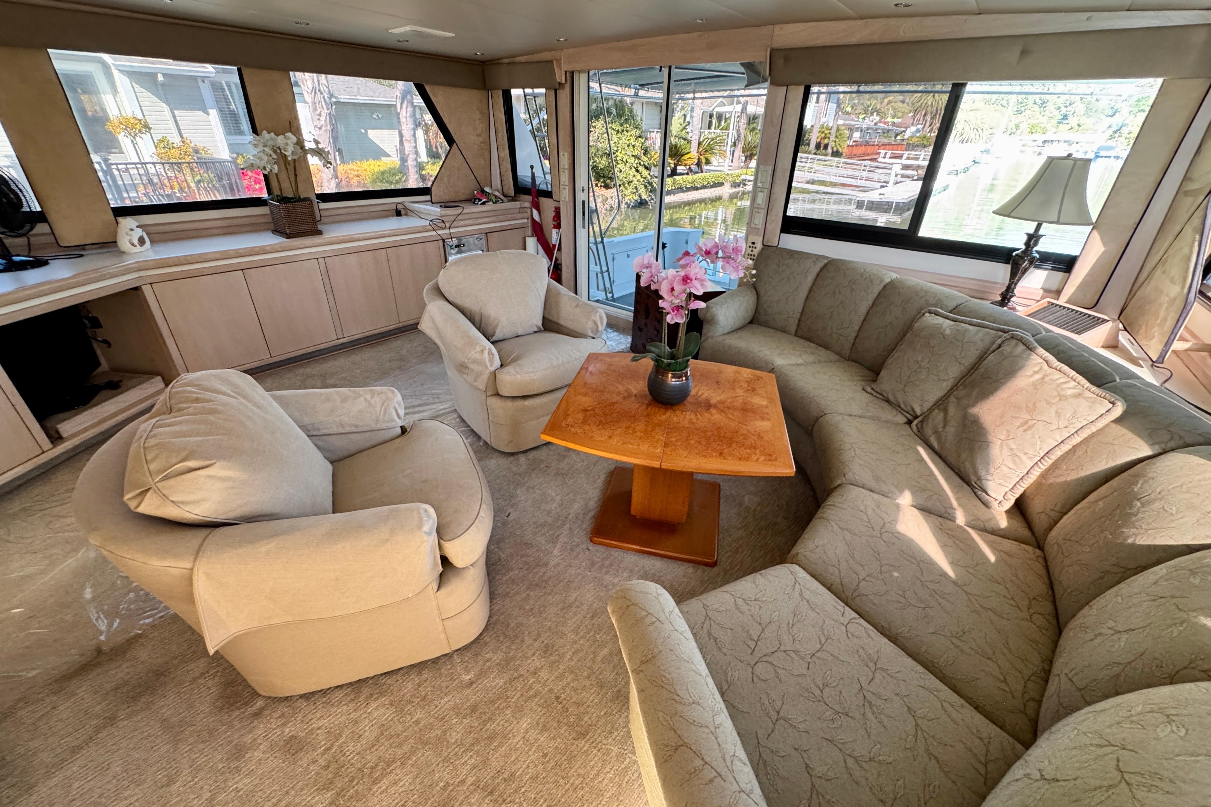 Luxurious interior of 1993 Tollycraft 57 Pilothouse Motor Yacht with plush seating and elegant decor.
