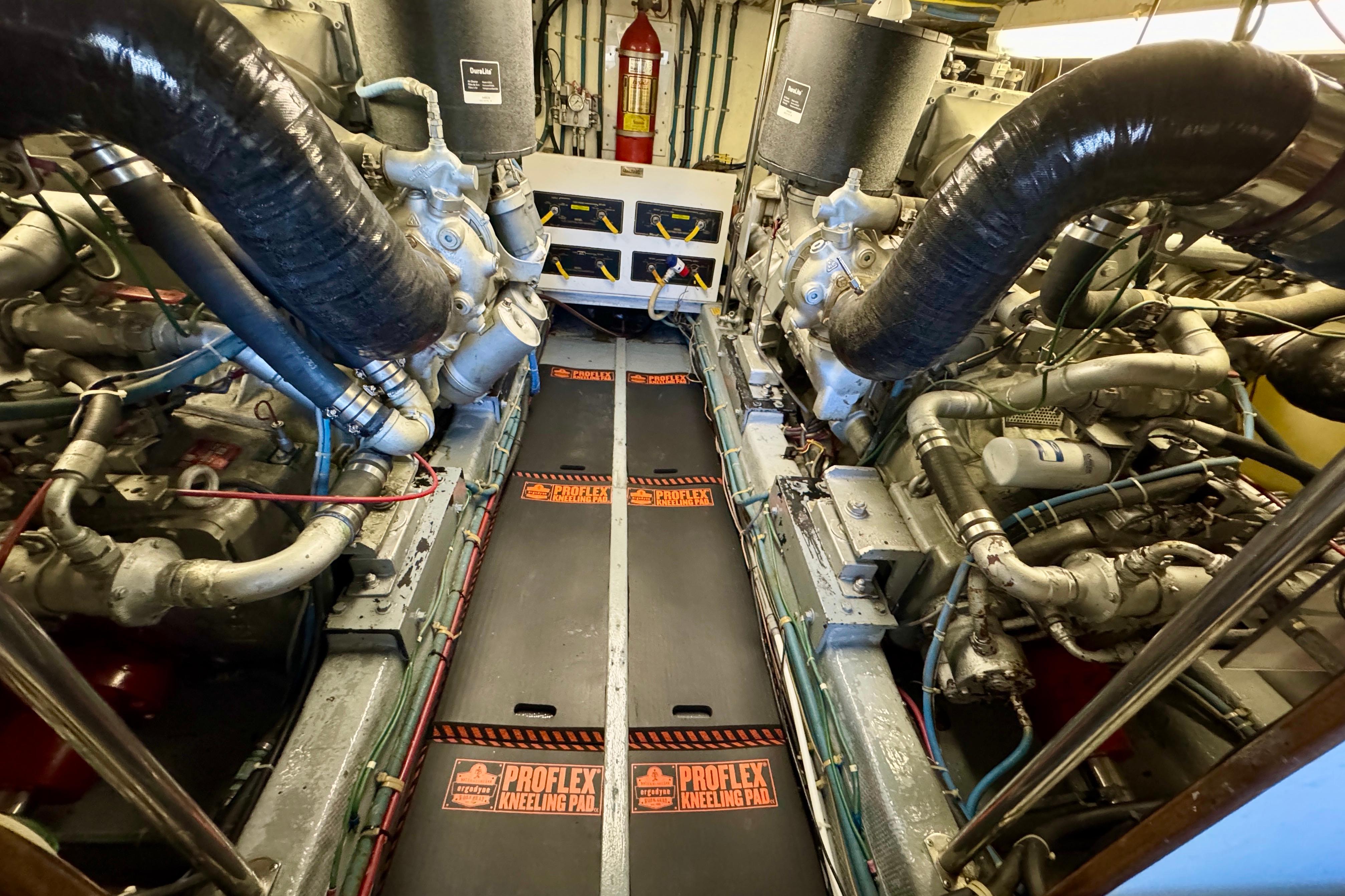 Engine room of 1993 Tollycraft 57 Pilothouse Motor Yacht with visible machinery and equipment.