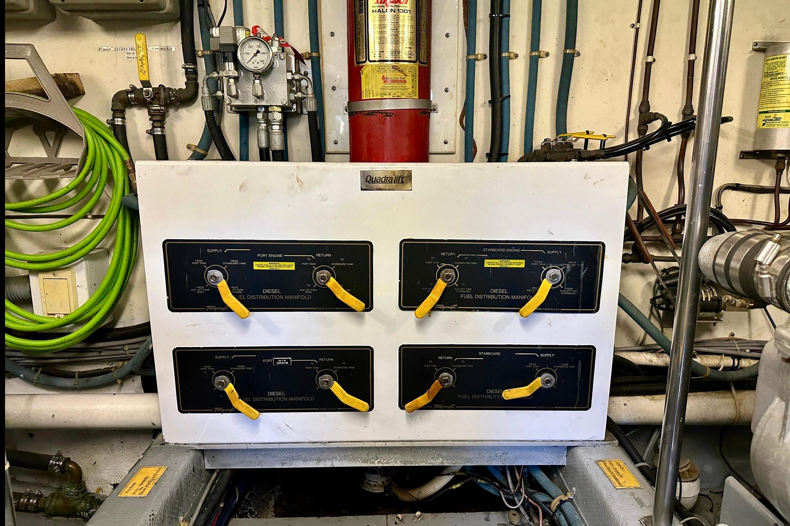 Engine room of 1993 Tollycraft 57 Pilothouse Motor Yacht with fuel distribution manifold.