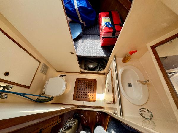 Interior of 1984 Camper & Nicholsons Nicholson 35 yacht bathroom with sink and toilet.