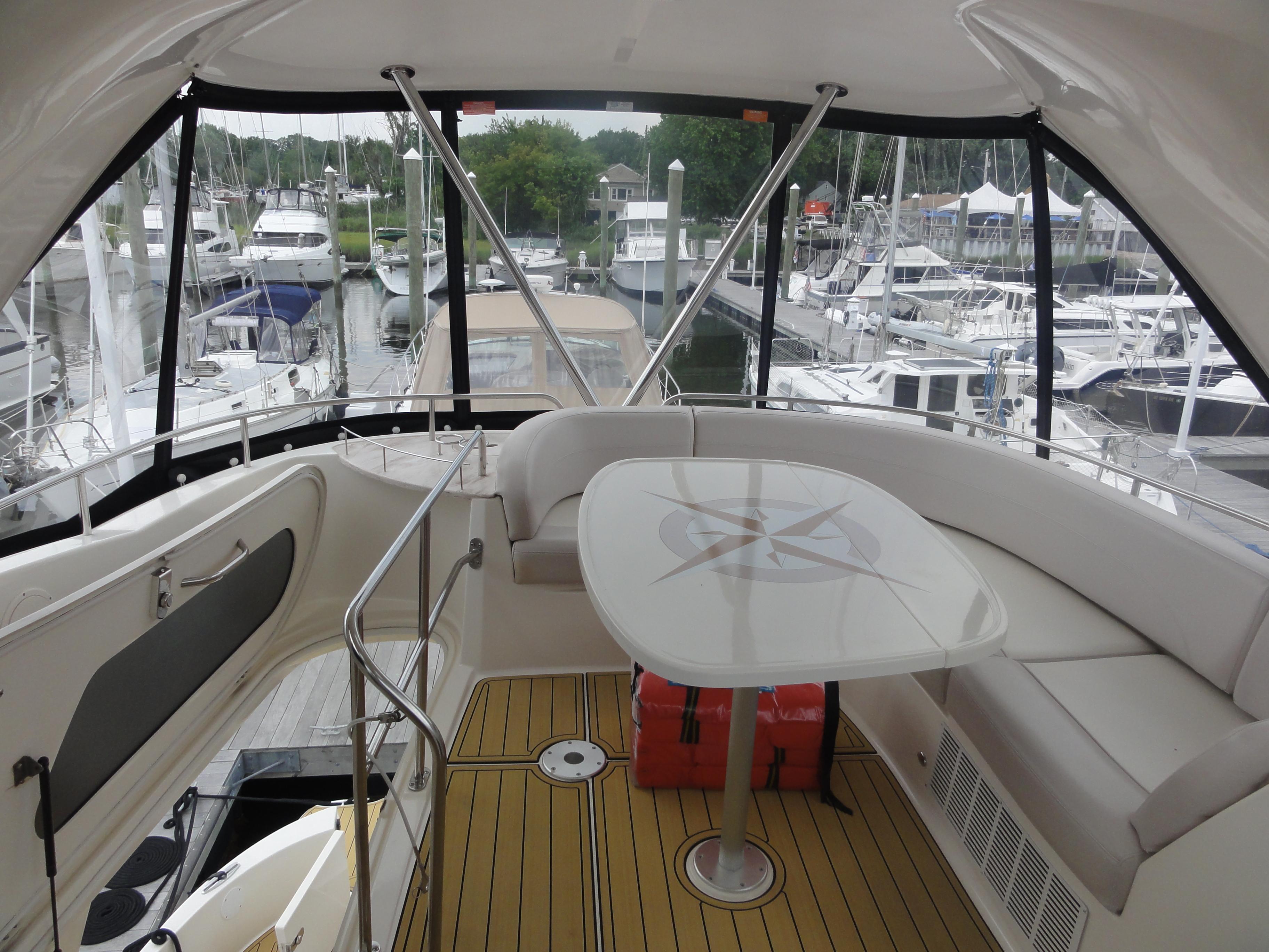 Meridian-441 Sedan 2009-Be Lisamo RI-US-2009 Meridian 441 Sedan yacht interior with seating and table, docked at marina.-9714633 | Thumbnail