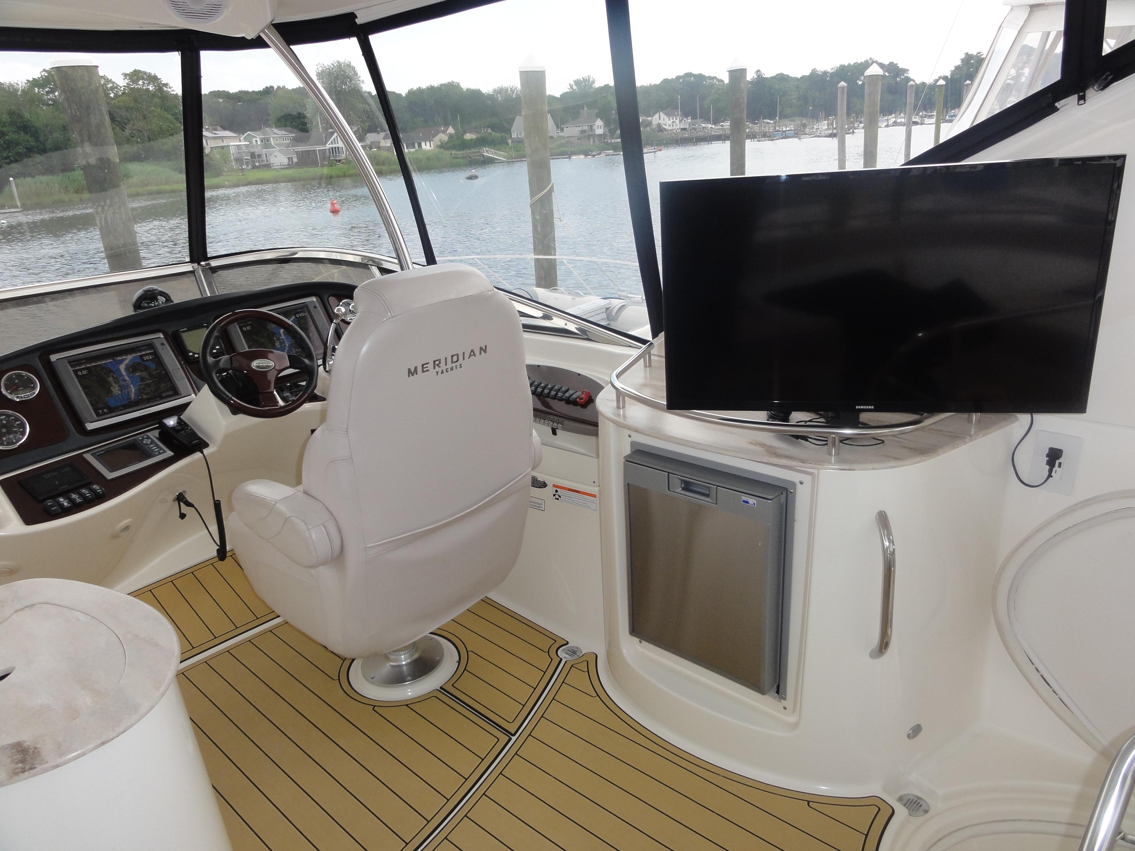 Meridian-441 Sedan 2009-Be Lisamo RI-US-Interior of 2009 Meridian 441 Sedan yacht with helm, seating, and TV.-9714633 | Thumbnail