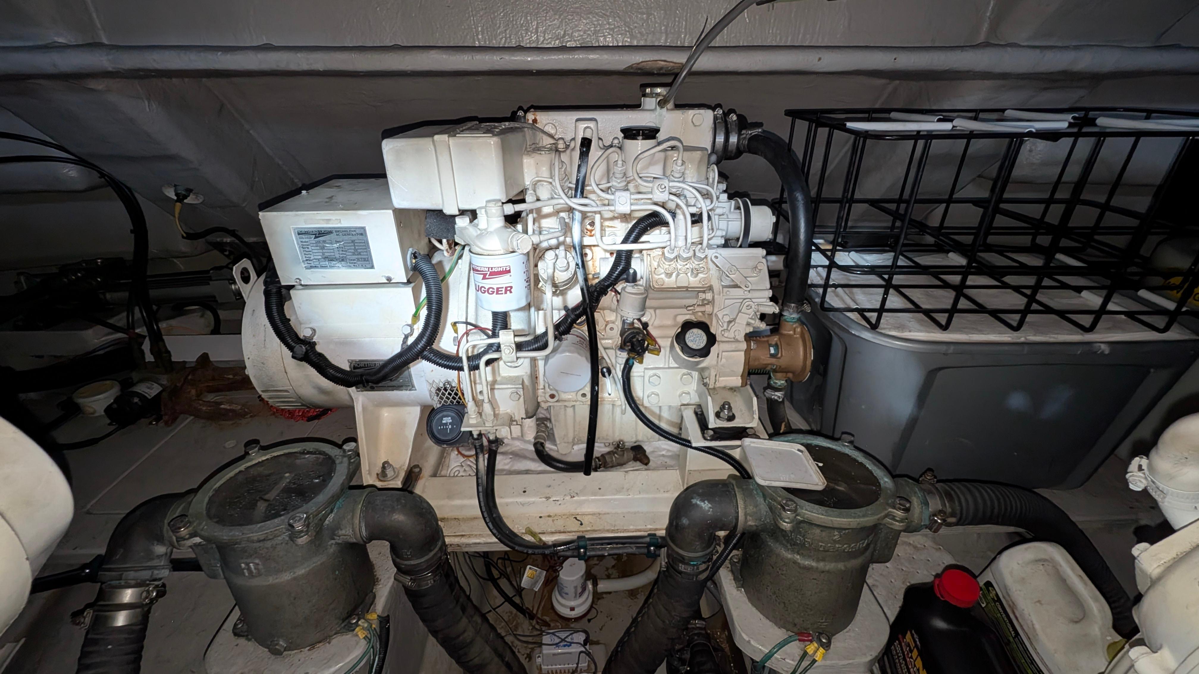 Engine room of a 2004 Sunseeker Portofino yacht, showcasing mechanical components.