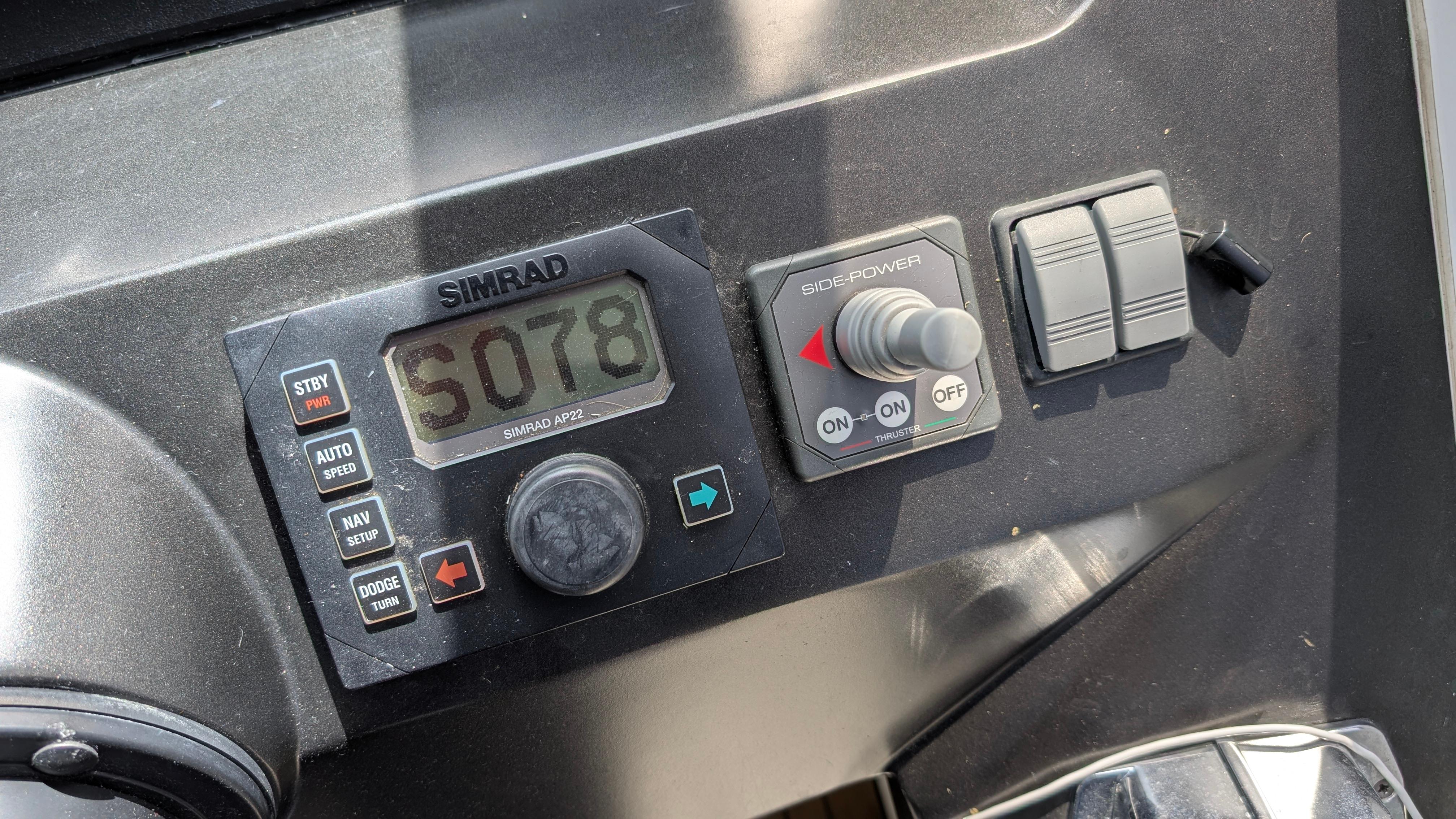 Control panel of a 2004 Sunseeker Portofino yacht with Simrad display.