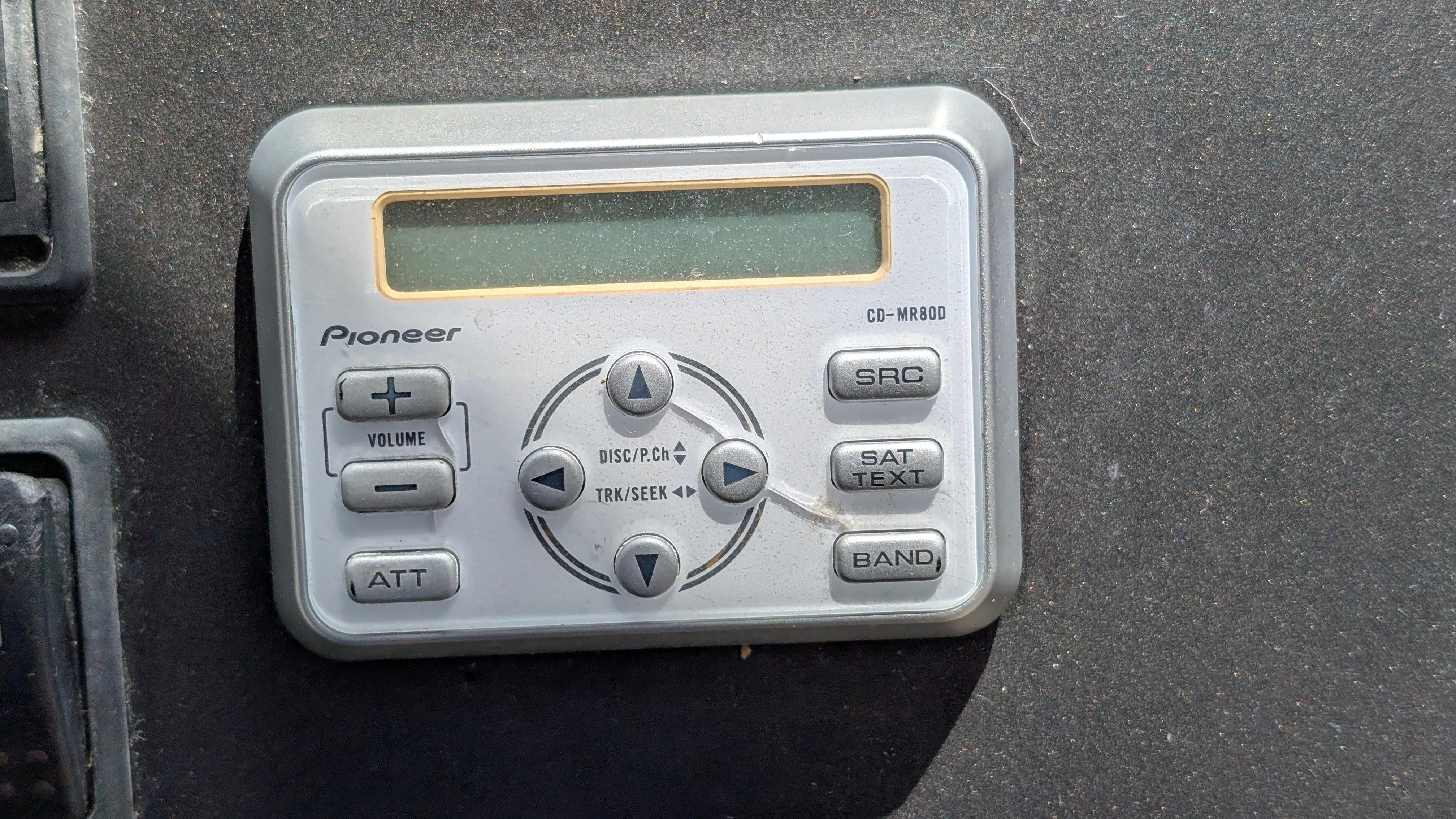 Pioneer CD-MR80D marine remote control on 2004 Sunseeker Portofino yacht dashboard.