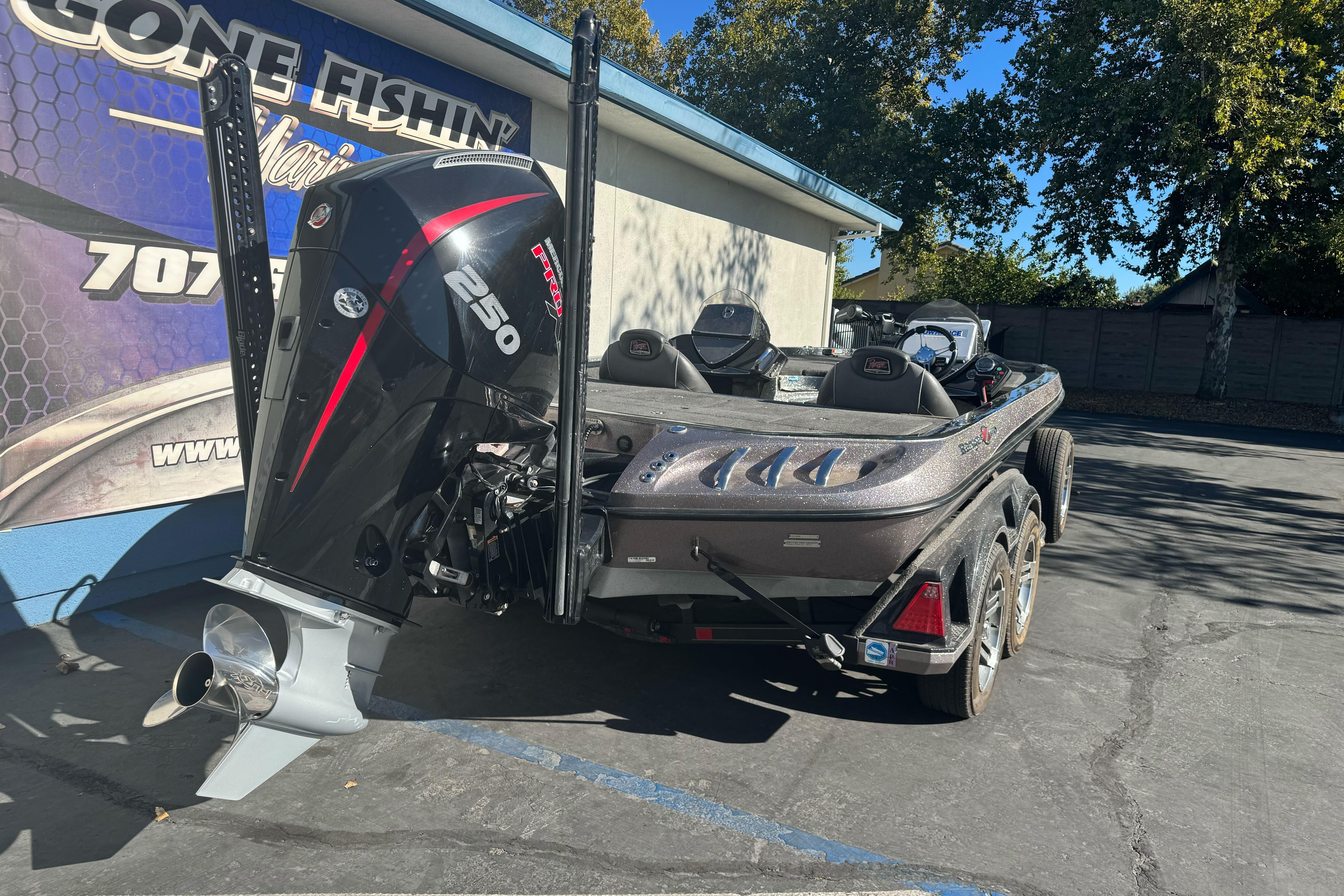 2020 Ranger Z521C Ranger Cup Equipped boat with powerful outboard motor, parked outdoors.