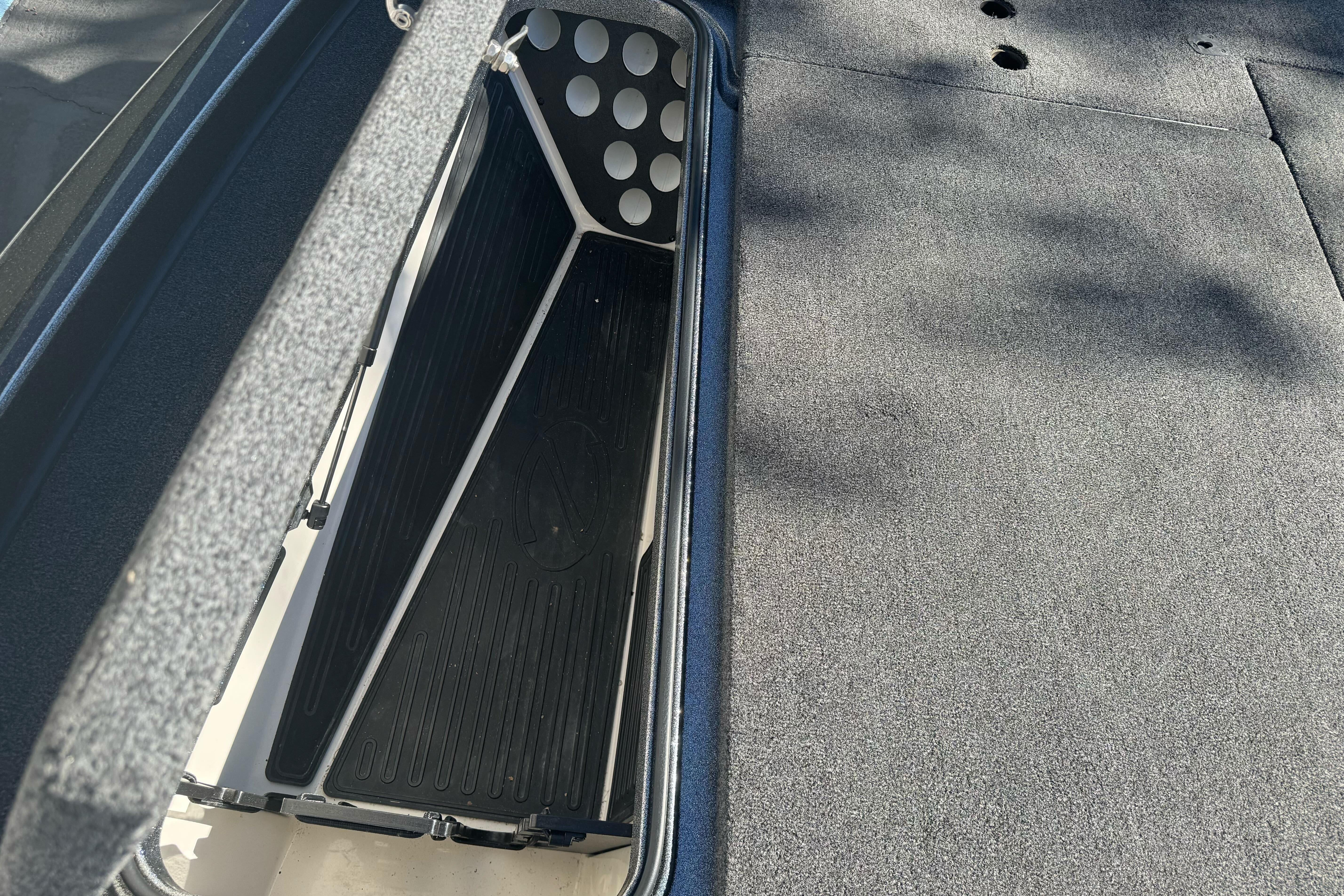 2020 Ranger Z521C Ranger Cup Equipped boat storage compartment, open with carpeted interior.