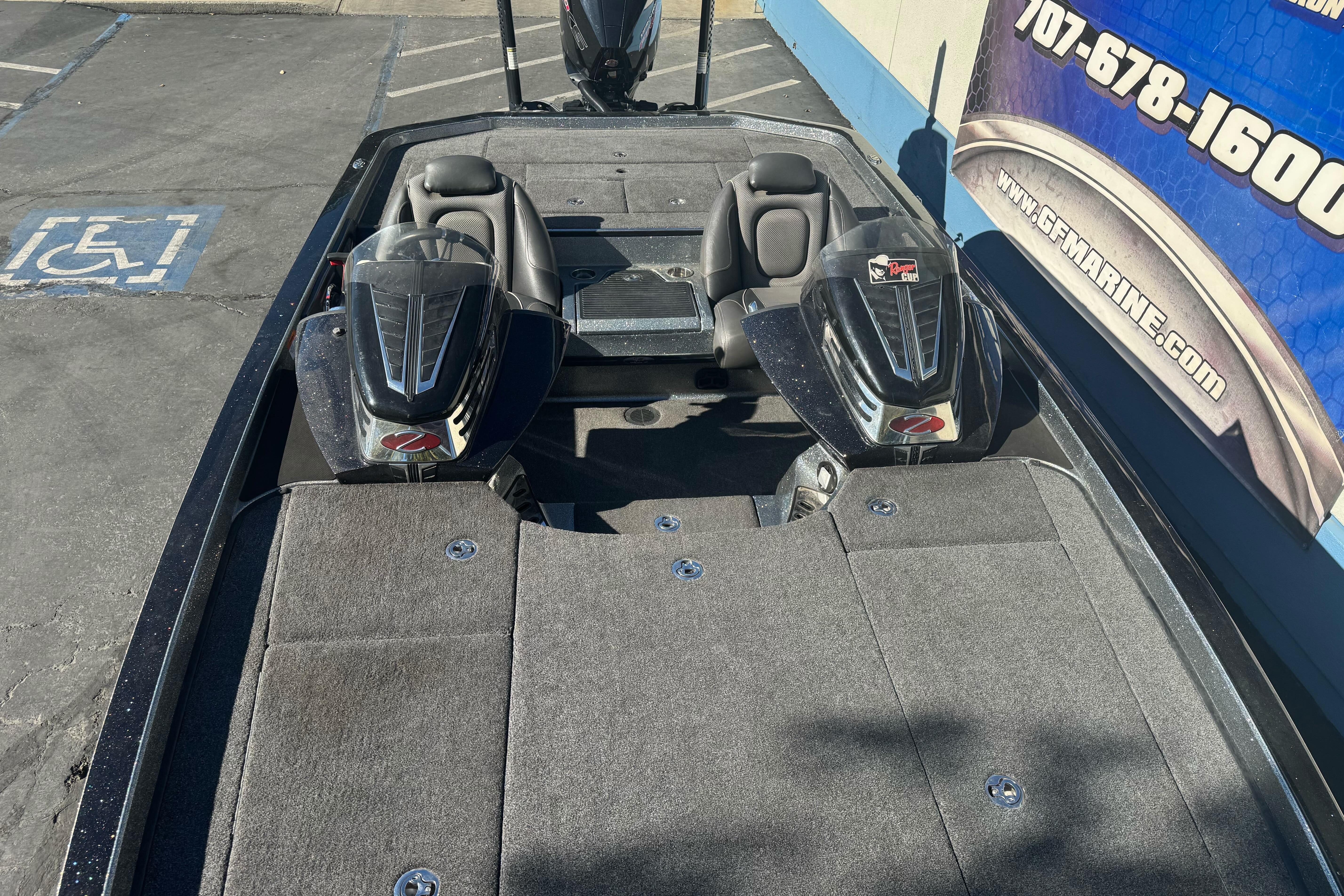 2020 Ranger Z521C Ranger Cup Equipped boat, dual seats, parked near a marine store.