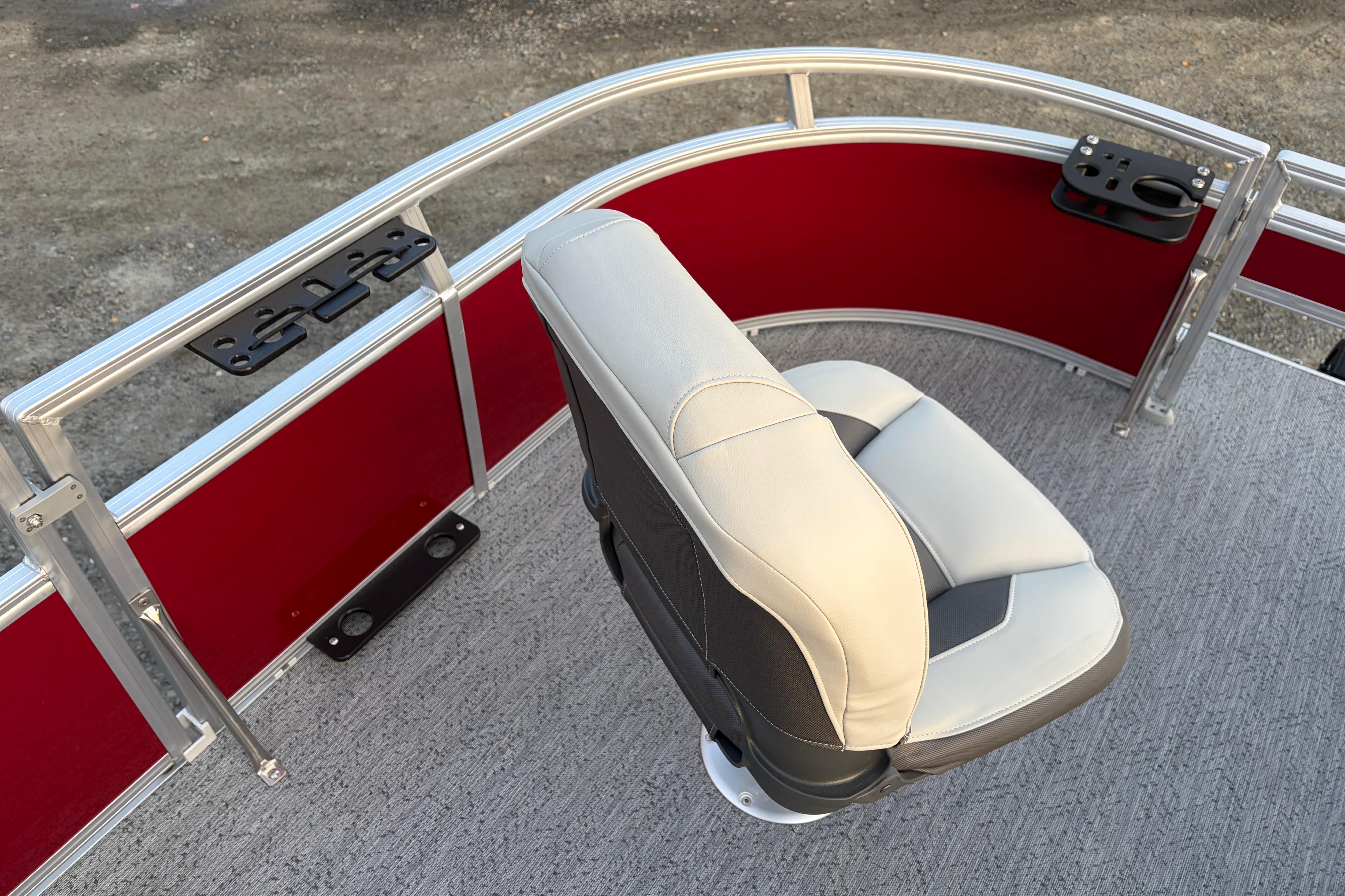 2026 Sun Tracker Bass Buggy 16 XL Select boat seat with red paneling and gray flooring.