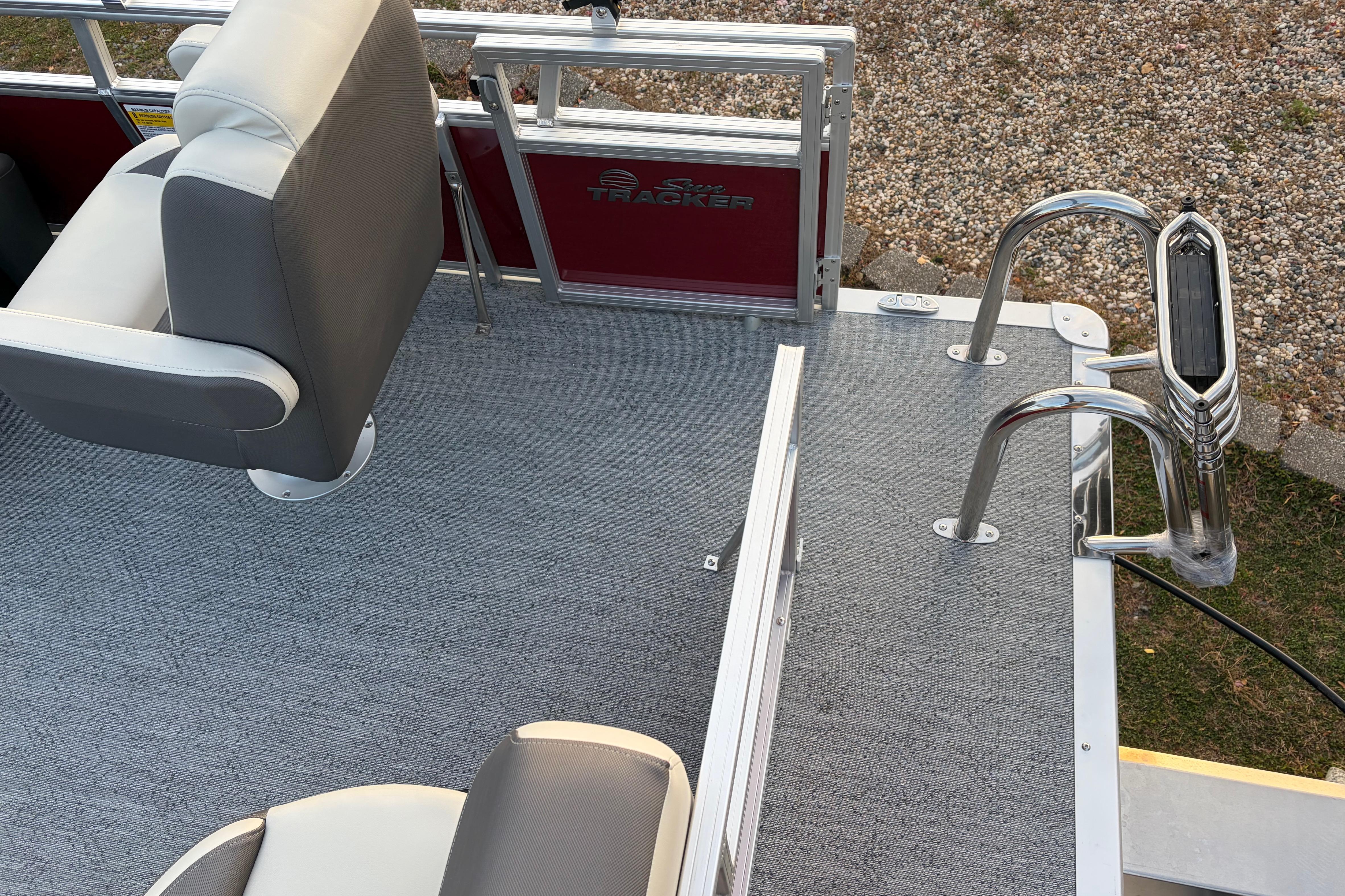 2026 Sun Tracker Bass Buggy 16 XL Select pontoon boat interior with seating and ladder.