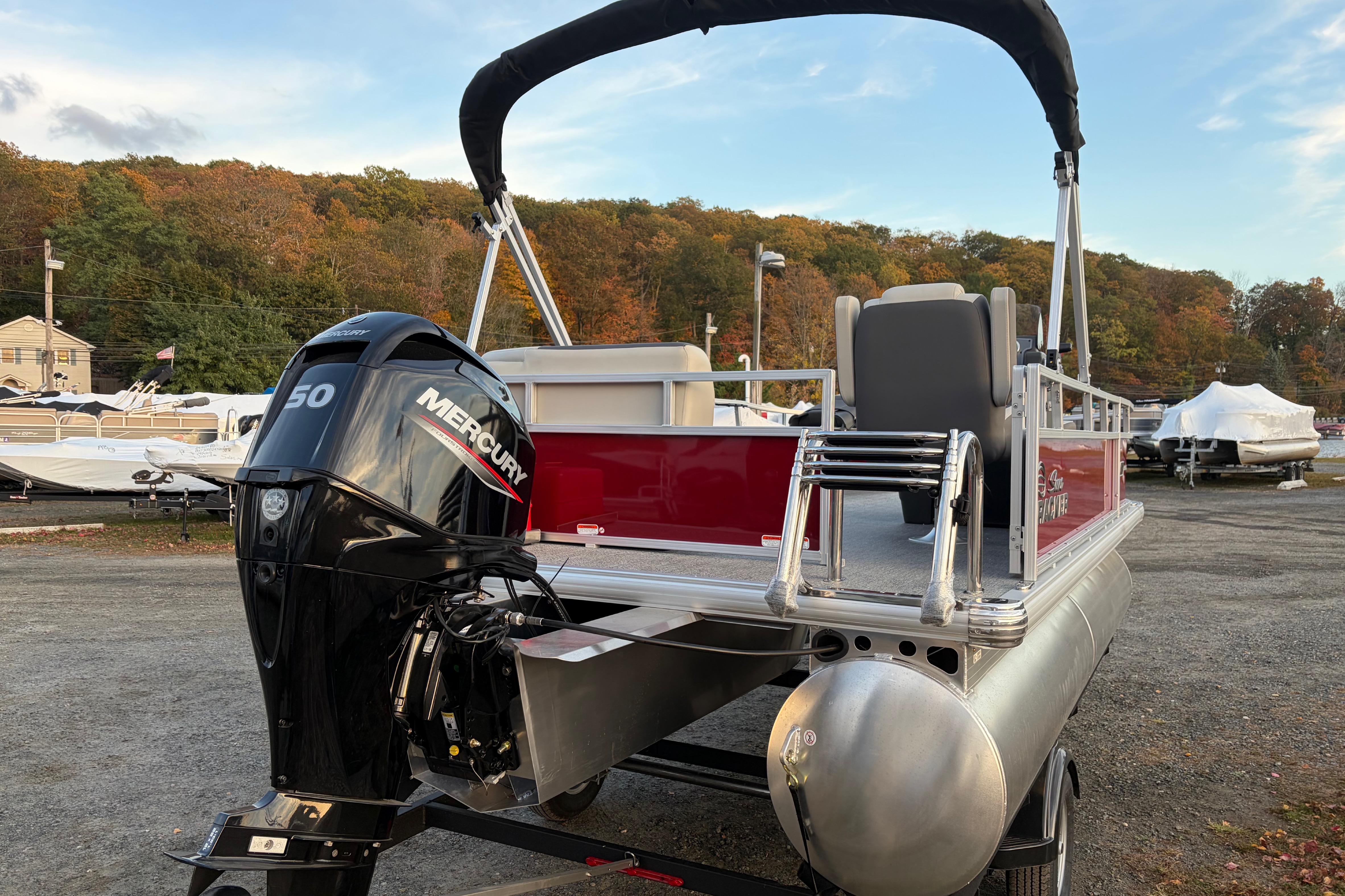 2026 Sun Tracker Bass Buggy 16 XL Select pontoon boat with Mercury 50 engine.