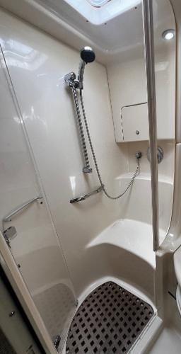 Shower area in 2000 Sea Ray 380 Sundancer yacht, featuring modern fixtures and seating.
