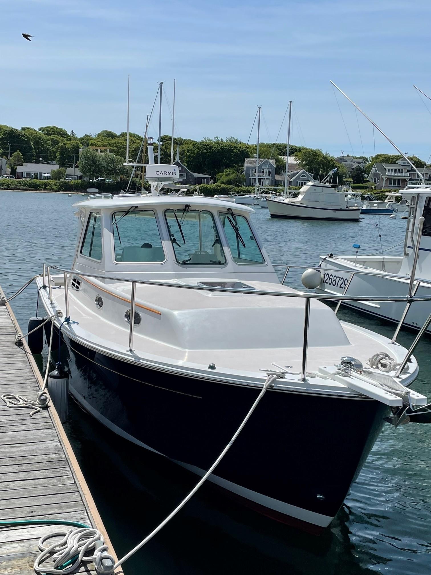 29 ft Back Cove 29 Hardtop Express Starboard Bow at Dock