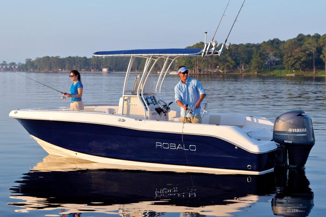 Manufacturer Provided Image: 2016 Robalo R200 Center Console boat on calm water with two people fishing.