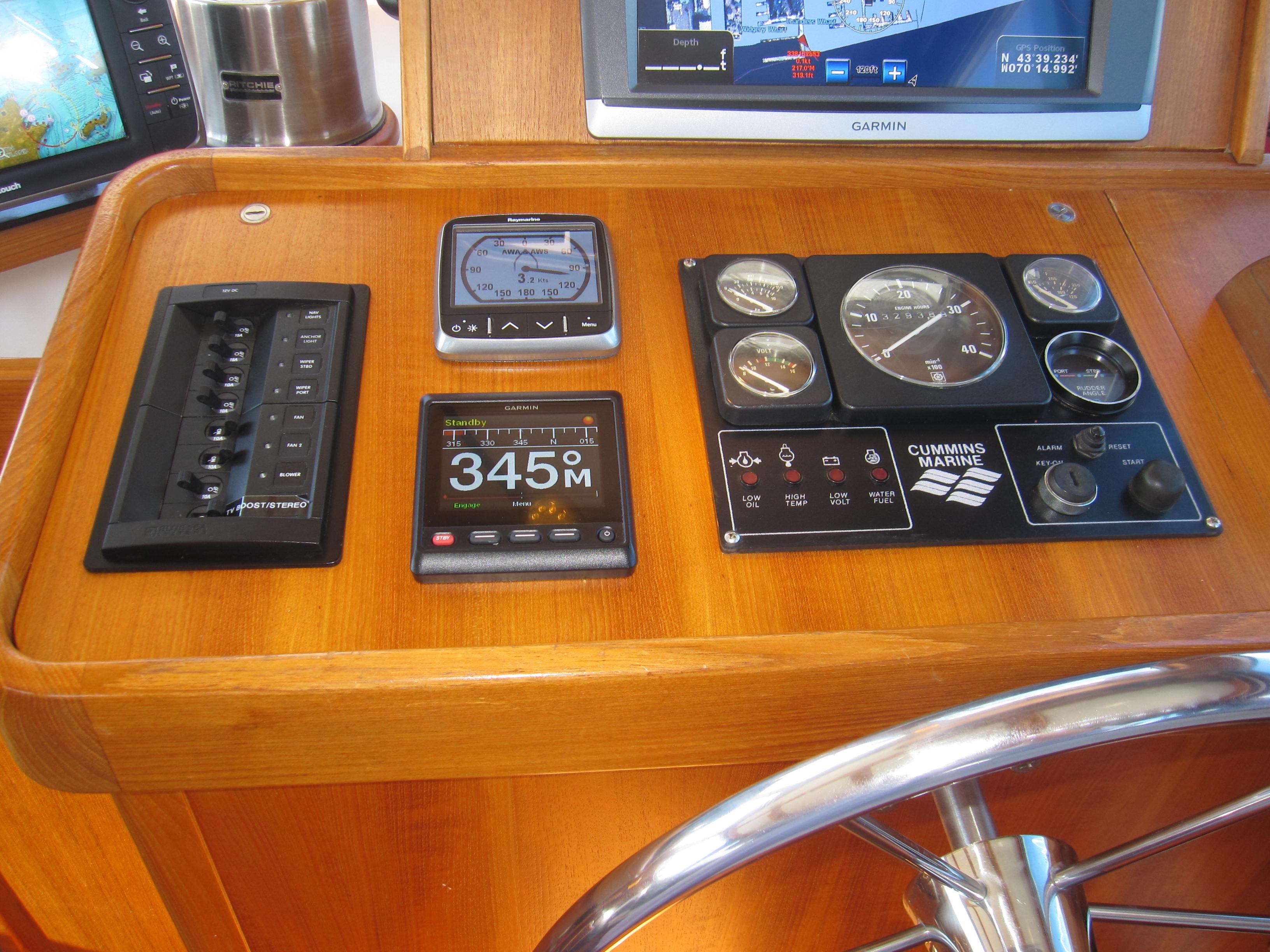 Control panel of a 1990 Blue Seas 31 Hardtop Cruiser with navigation instruments.