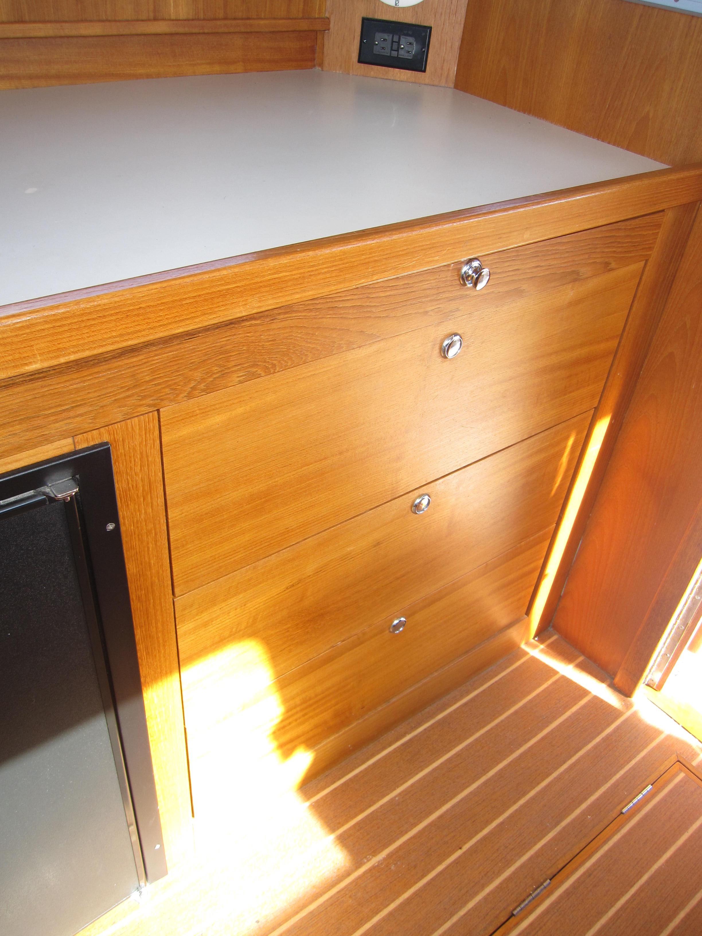 Wooden cabinetry inside a 1990 Blue Seas 31 Hardtop Cruiser.