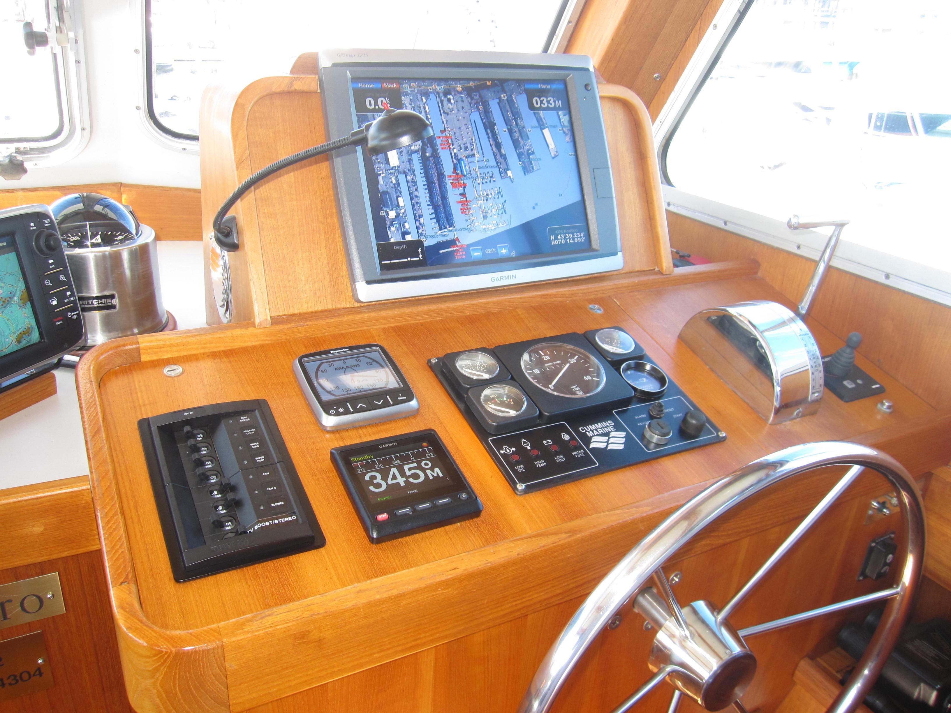 Control panel of a 1990 Blue Seas 31 Hardtop Cruiser with navigation equipment.