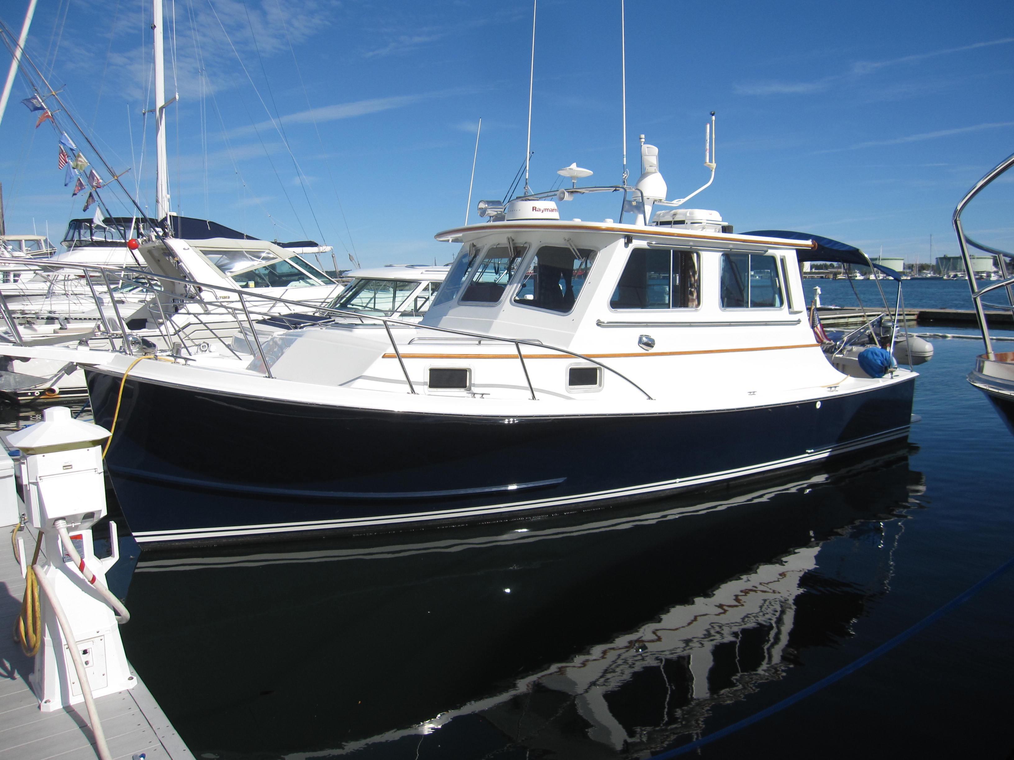 1990 Blue Seas 31 Hardtop Cruiser docked at marina.