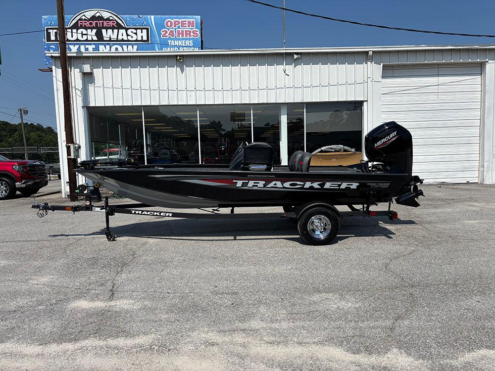2025 Tracker Pro Team 175 Crappie Edition boat parked outside a truck wash.