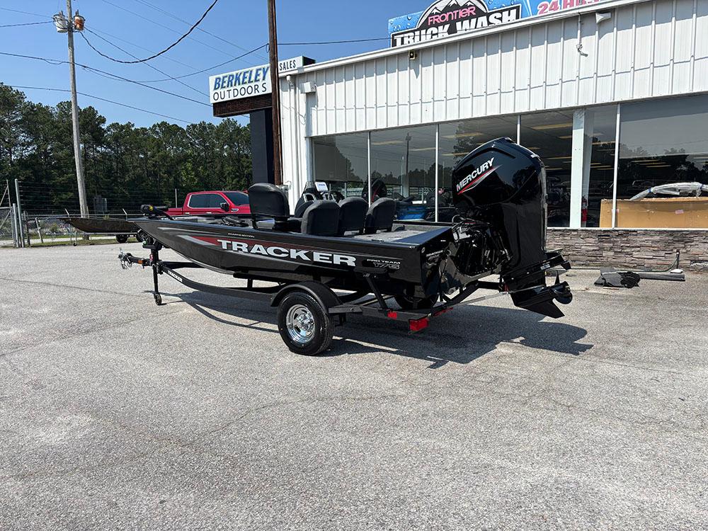 2025 Tracker Pro Team 175 Crappie Edition boat on trailer outside dealership.