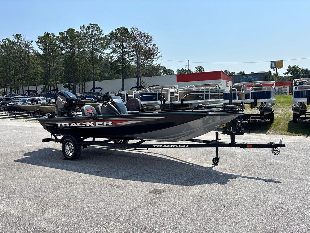 2025 Tracker Pro Team 175 Crappie Edition boat on trailer in outdoor dealership lot.