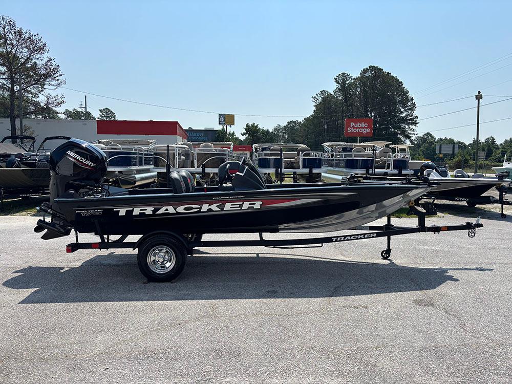 2025 Tracker Pro Team 175 Crappie Edition boat in parking lot, side view.