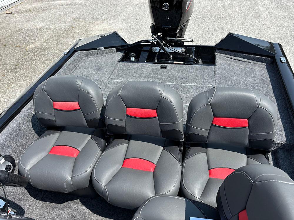2025 Tracker Pro Team 175 Crappie Edition boat seats with red accents and motor.