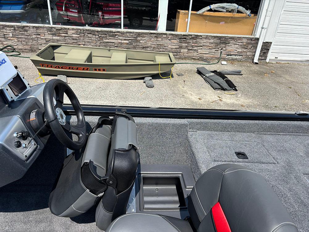 2025 Tracker Pro Team 175 Crappie Edition boat interior with steering wheel and seating.