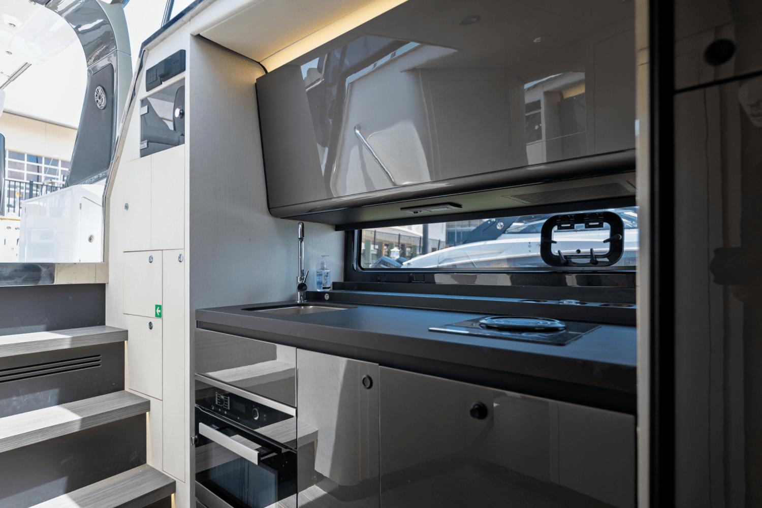 Azimut-AZ42 VERVE 2023-Shee-naughty TX-US-Modern kitchen interior of 2023 Azimut AZ42 VERVE yacht, featuring sleek cabinetry and appliances.-9104707 | Thumbnail
