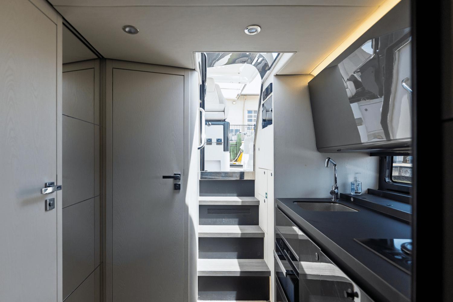 Azimut-AZ42 VERVE 2023-Shee-naughty TX-US-Modern interior of 2023 Azimut AZ42 VERVE yacht with sleek kitchen and stairs.-9104707 | Thumbnail