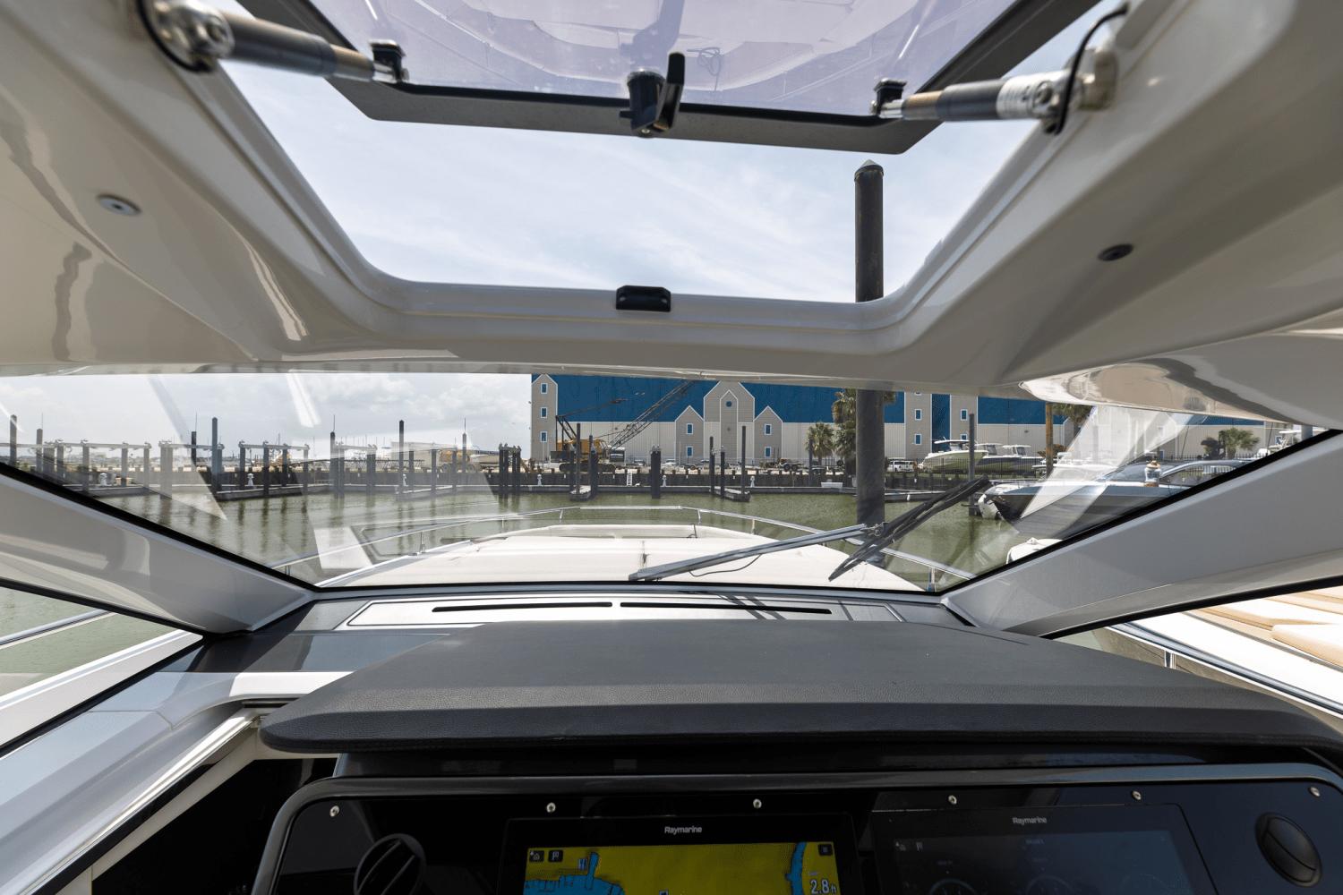 Azimut-AZ42 VERVE 2023-Shee-naughty TX-US-Interior view from 2023 Azimut AZ42 VERVE yacht, showcasing dashboard and marina scenery.-9104707 | Thumbnail