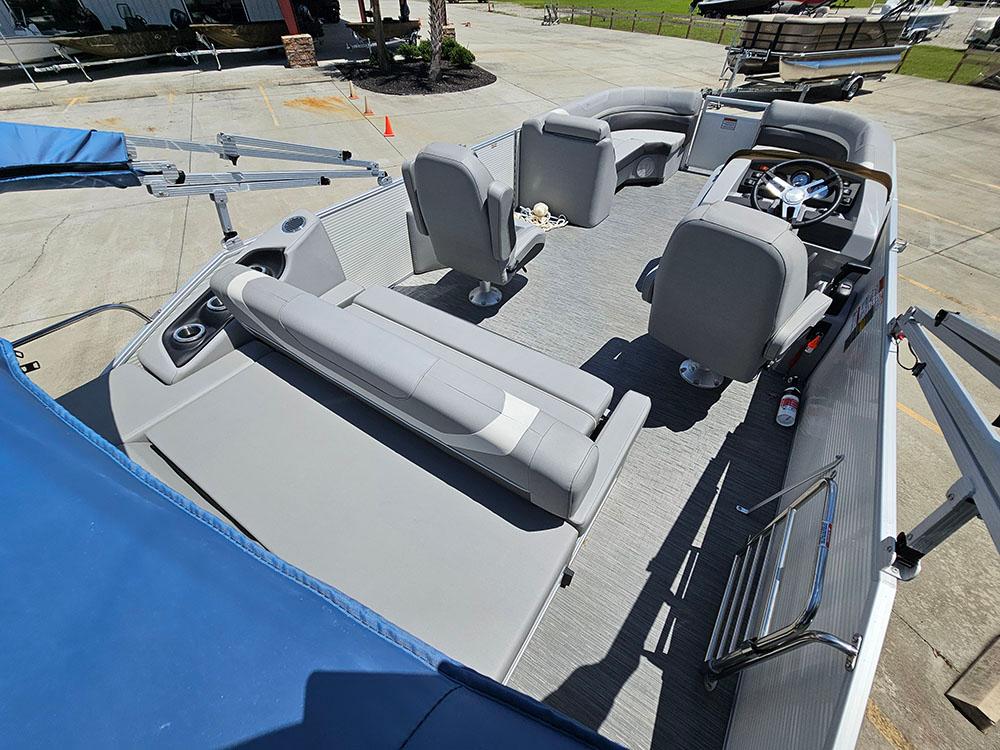 2022 Bennington 22 SXSB pontoon boat interior with gray seating and steering console.