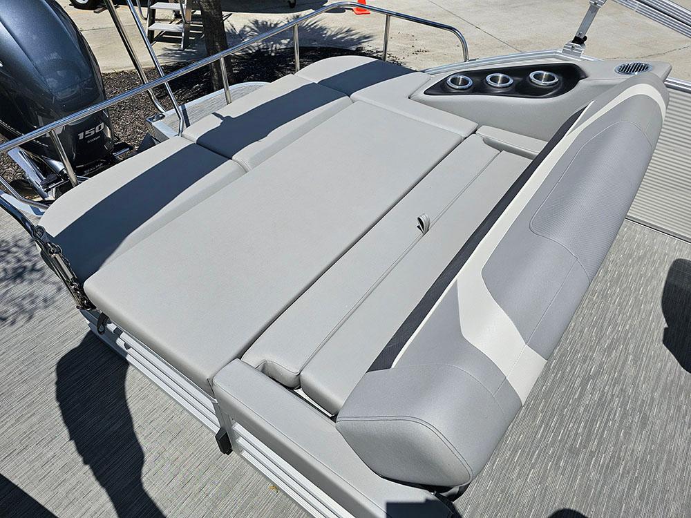 2022 Bennington 22 SXSB boat with gray seating and cup holders on deck.
