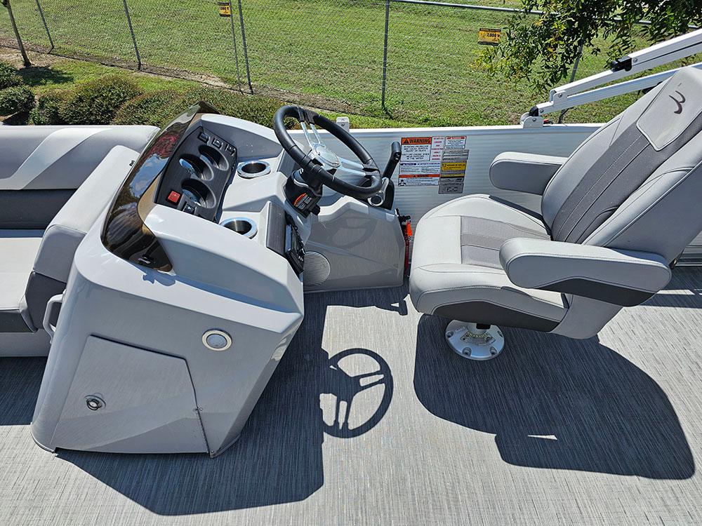 2022 Bennington 22 SXSB boat interior with steering console and captain's chair.