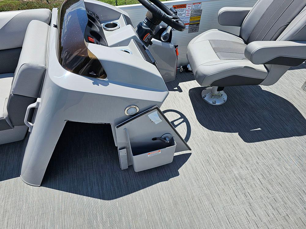 2022 Bennington 22 SXSB boat interior with steering console and captain's chair.
