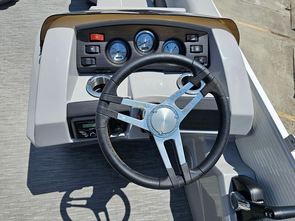 Steering console of 2022 Bennington 22 SXSB boat with gauges and controls.