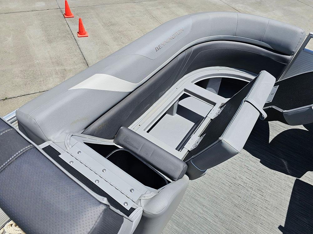 2022 Bennington 22 SXSB boat interior with gray seating and storage compartments.