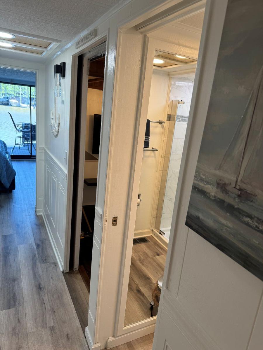 Stardust Cruisers-18 X 80 Houseboat 1986 -TN-US-Interior of 1986 Stardust Cruisers 18 X 80 Houseboat with hallway and bathroom view.-9804797 | Thumbnail