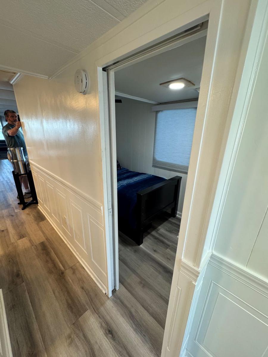 Stardust Cruisers-18 X 80 Houseboat 1986 -TN-US-Hallway view inside a 1986 Stardust Cruisers 18 X 80 houseboat, featuring a bedroom entrance.-9804797 | Thumbnail