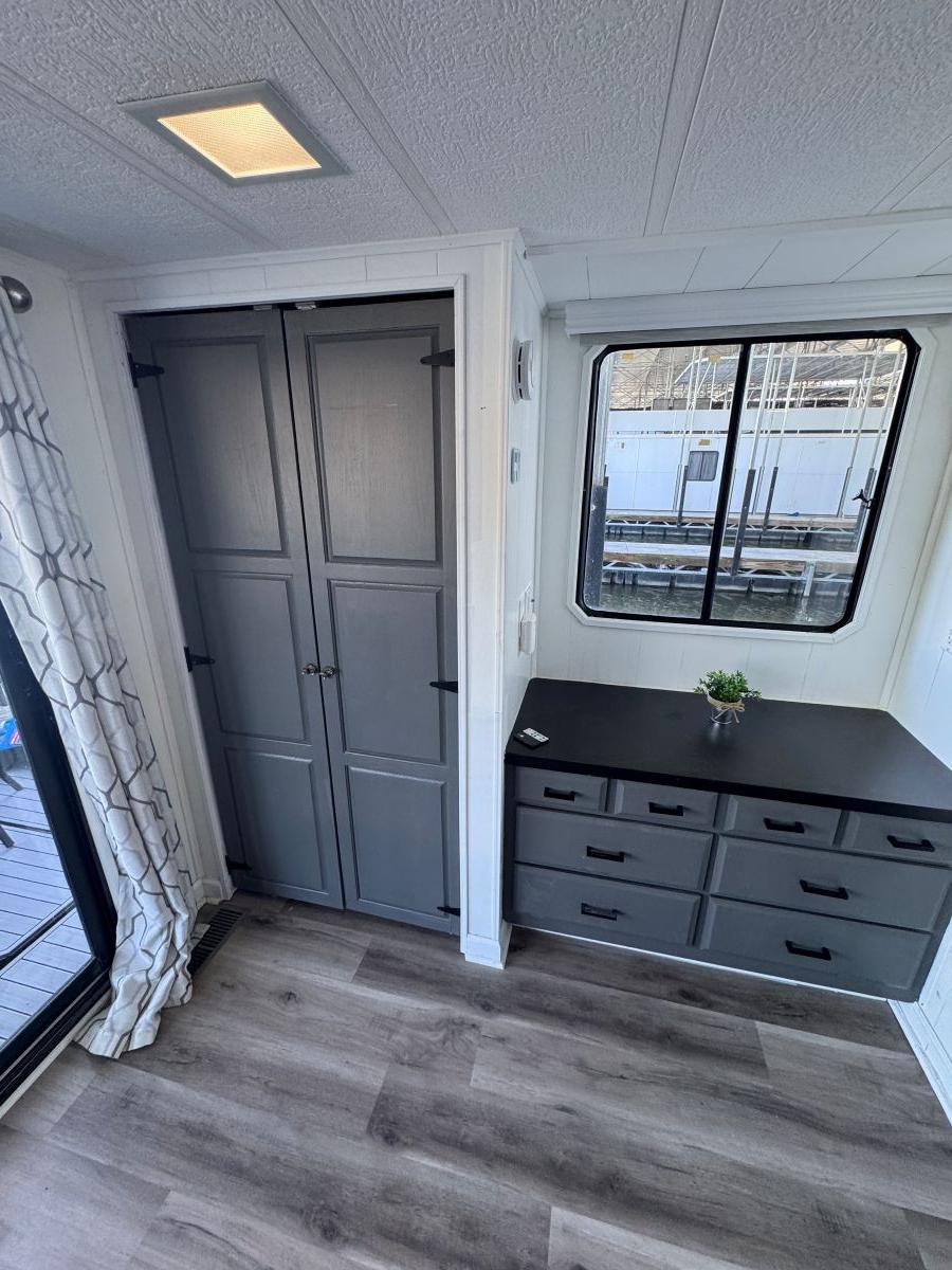 Stardust Cruisers-18 X 80 Houseboat 1986 -TN-US-1986 Stardust Cruisers houseboat interior with modern cabinets and window view.-9804797 | Thumbnail