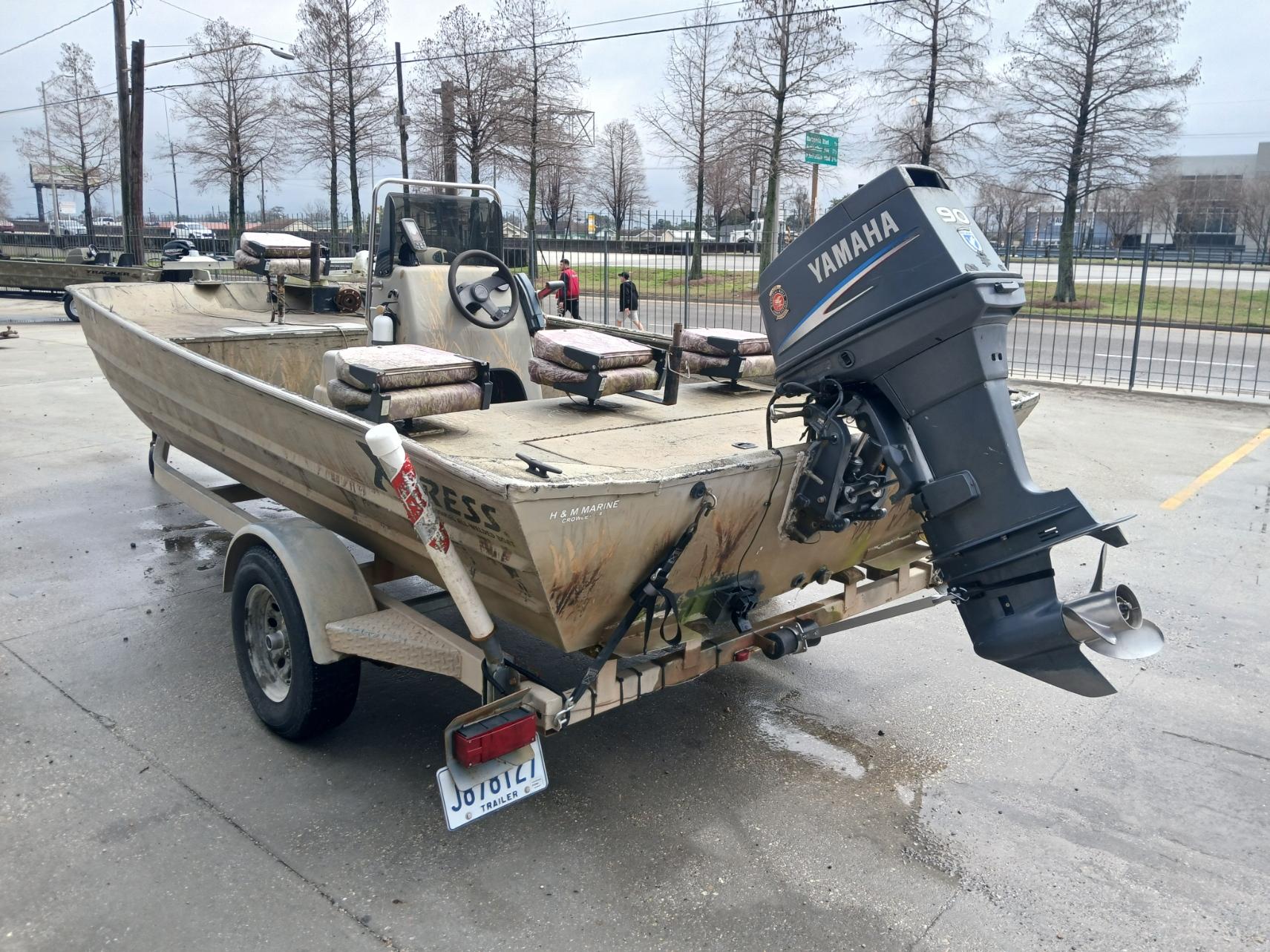 2004 Xpress 18 boat with Yamaha outboard motor on a trailer.