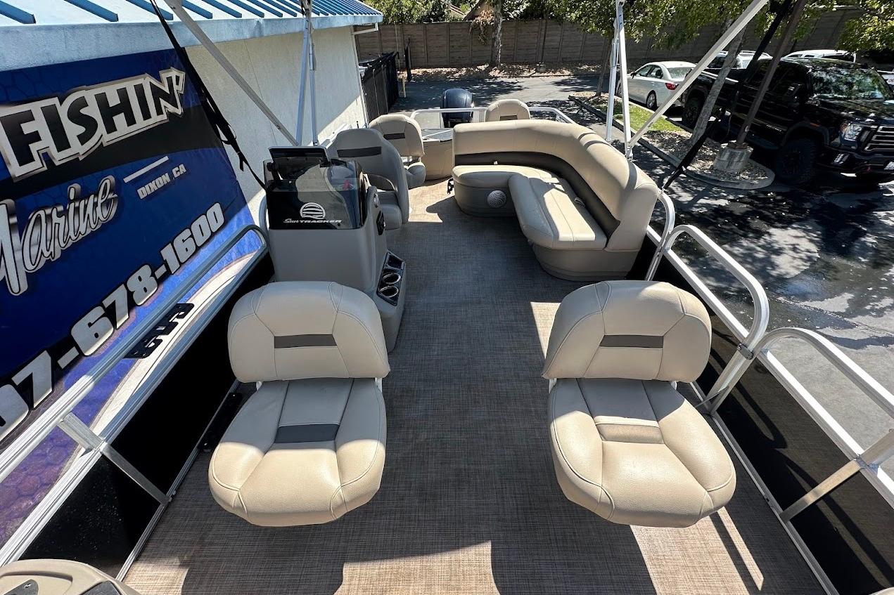 2022 Sun Tracker Bass Buggy 18 DLX pontoon boat with spacious seating and modern design.