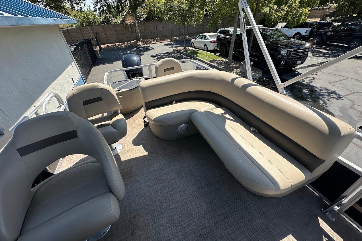 2022 Sun Tracker Bass Buggy 18 DLX pontoon boat with spacious seating and modern design.