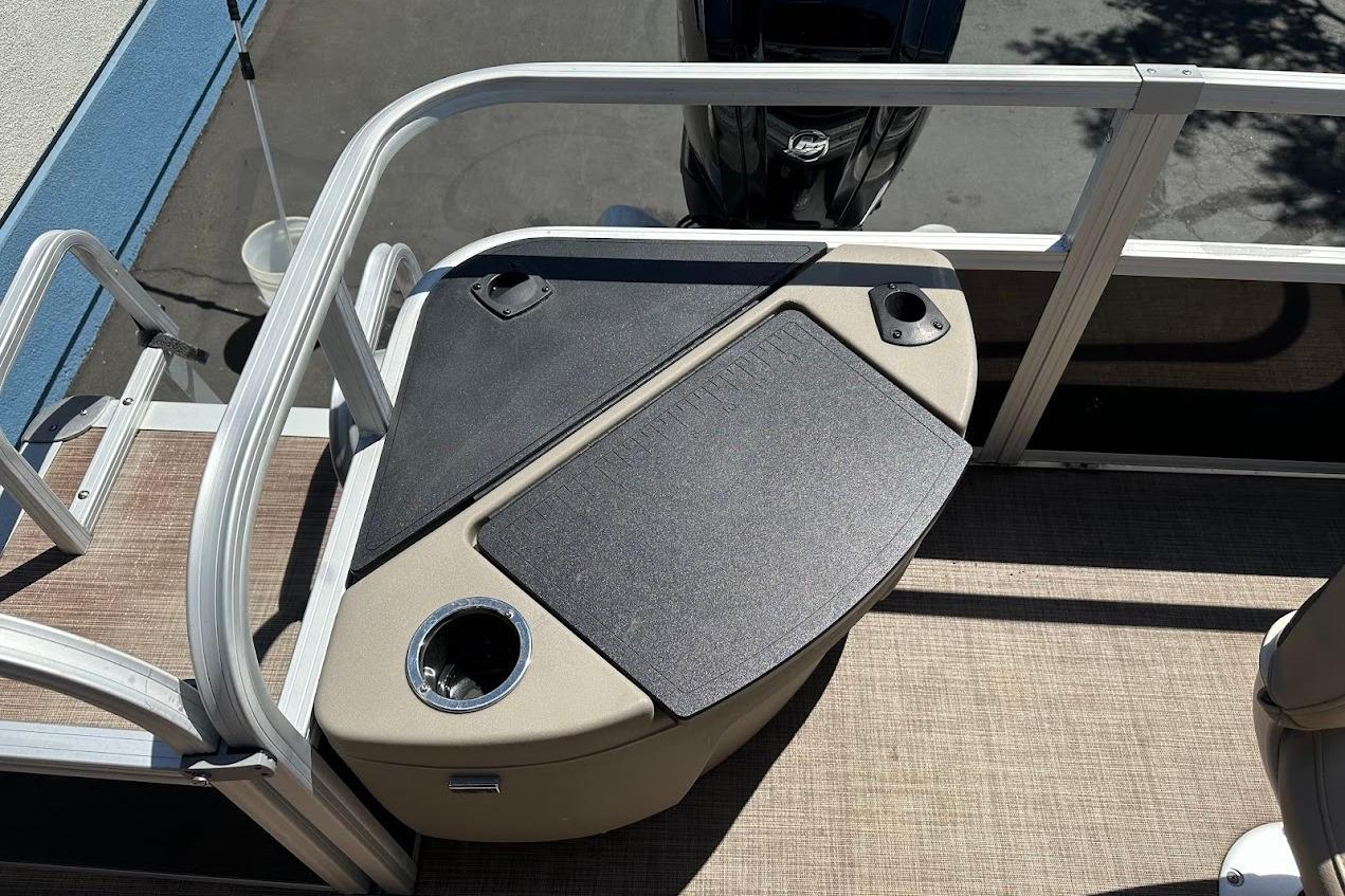 2022 Sun Tracker Bass Buggy 18 DLX boat deck with seating and cup holders.