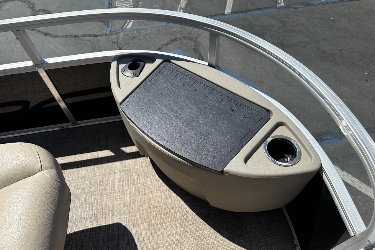 2022 Sun Tracker Bass Buggy 18 DLX boat interior with cup holders and measuring board.