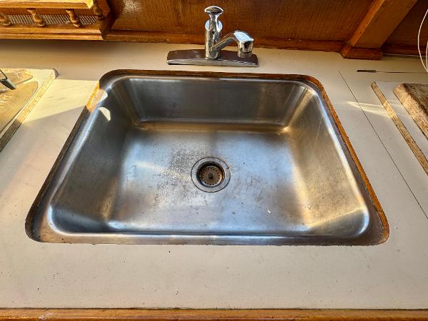 Stainless steel sink on 1979 Grand Banks Classic boat.