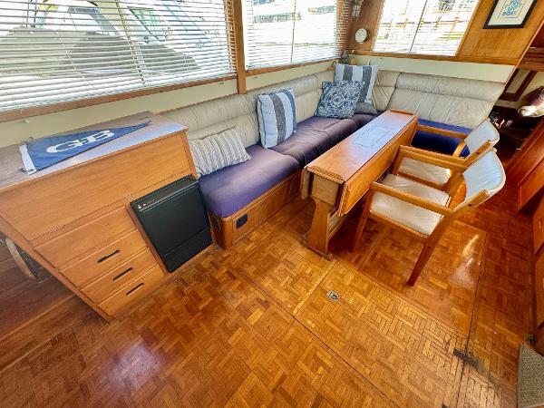 1979 Grand Banks Classic yacht interior with wood flooring and comfortable seating.