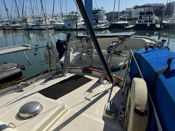 Salar 40 sailboat from 1975 docked in a marina with other boats.